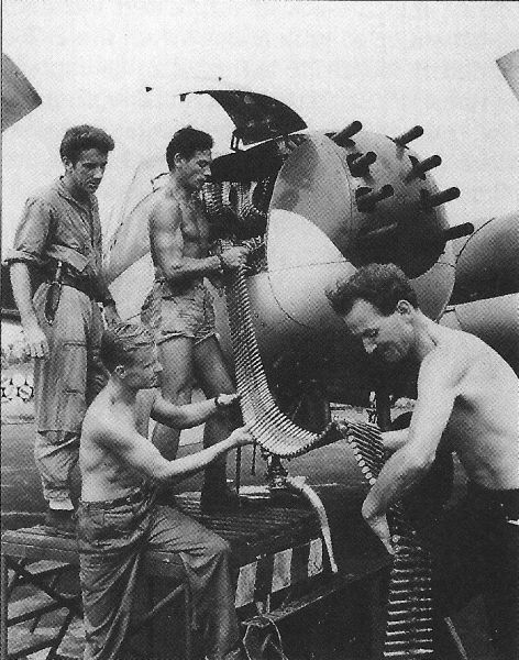 File:Cuban and British Armorers load a B-26K in the Congo.jpg